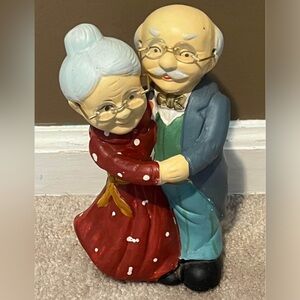 Old couple piggy bank